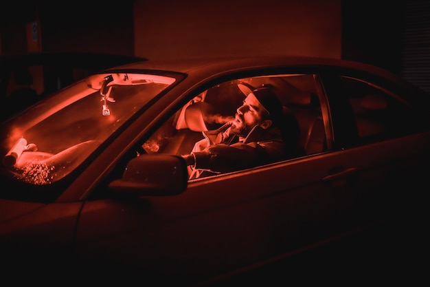A man Hotboxing in a car